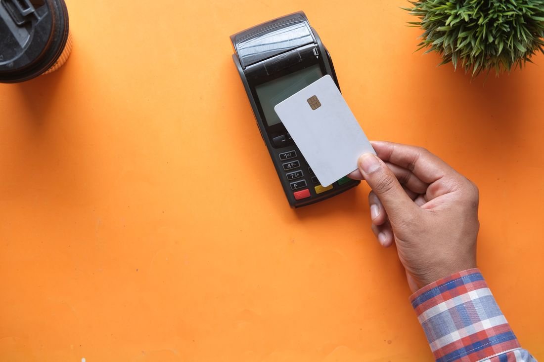 A small-business owner accepting a card payment with Square